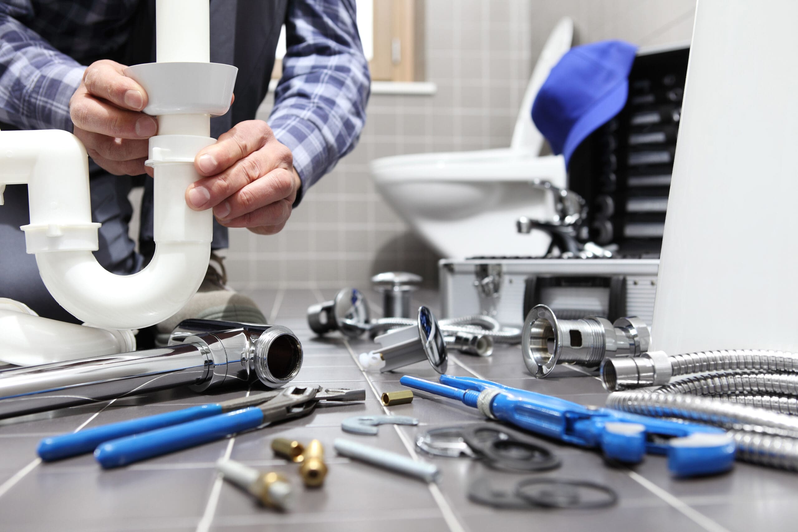 Plumber,At,Work,In,A,Bathroom,,Plumbing,Repair,Service,,Assemble