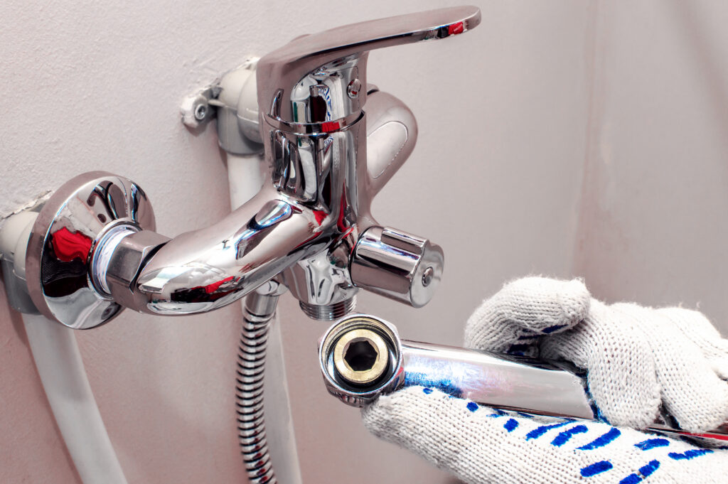 Installing,Faucet.,Plumber,Fixing,Water,Tap.,Men's,Hands,In,Gloves